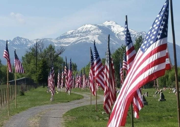 Prairie City Cemetery with mountain backdrop